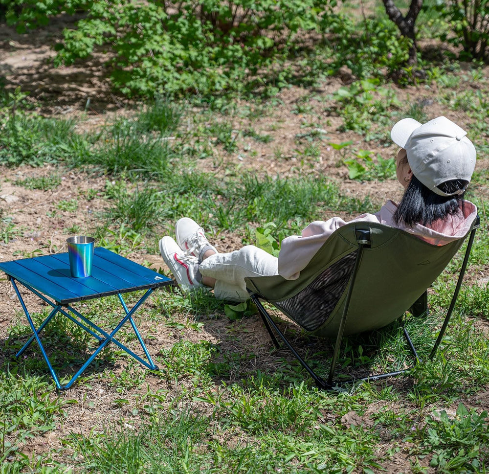 iClimb beige chair in use on a beach setting