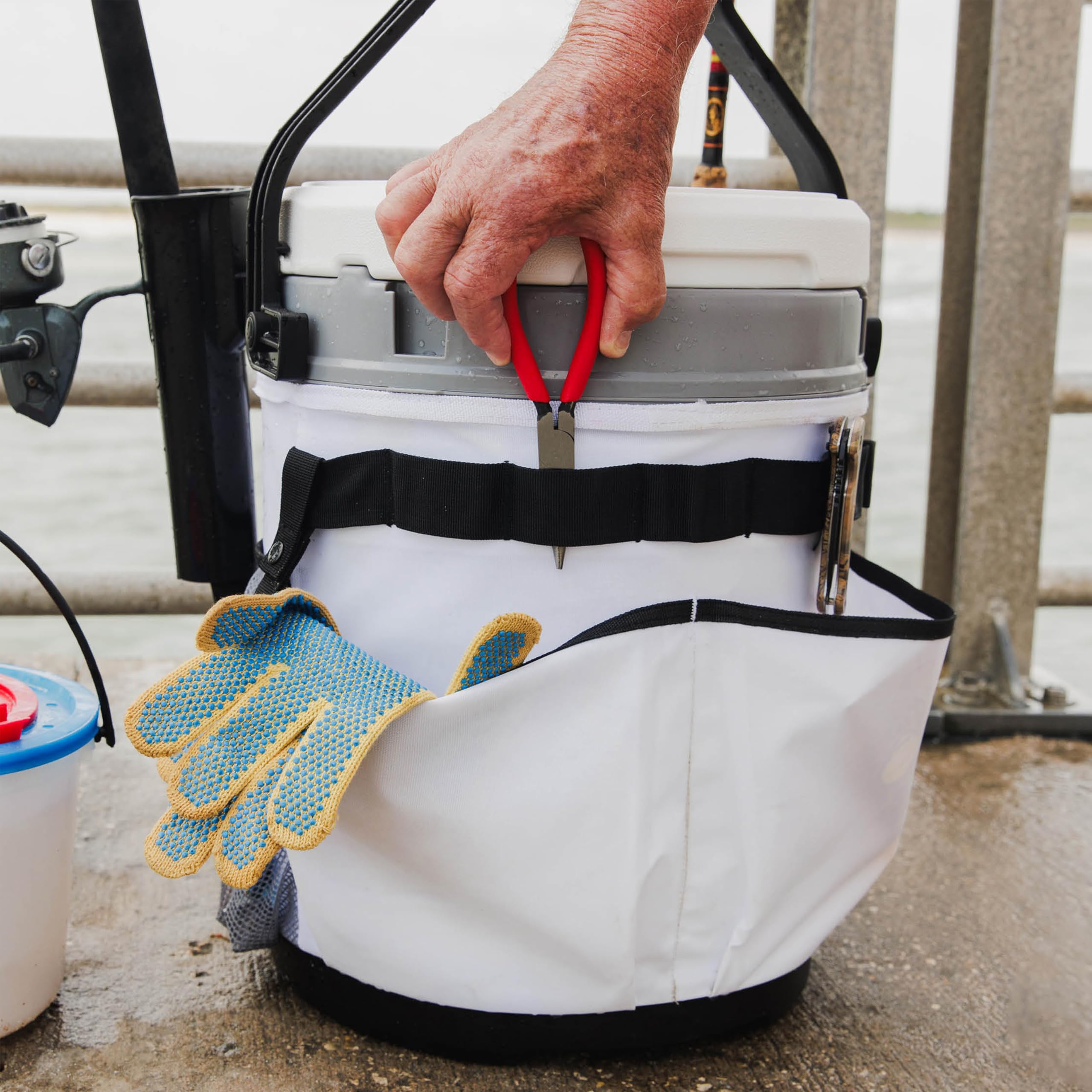 Igloo Marine 20 Qt cooler bucket rod holders ready for fishing setups.