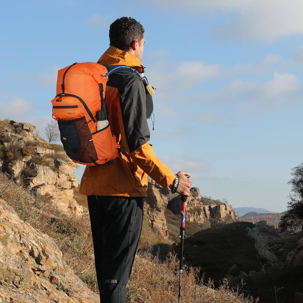 IX INOXTO hiking backpack orange back-strap view highlights ergonomic comfort for long hikes