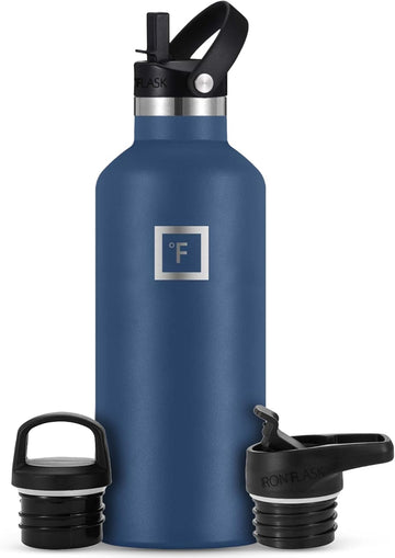 Iron Flask camping hydration bottle Twilight Blue on rugged trail for all-day hydration