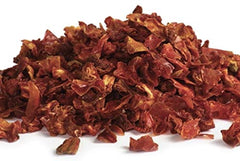 Its Delish dried tomato flakes being poured to enrich sauces and pasta dishes.