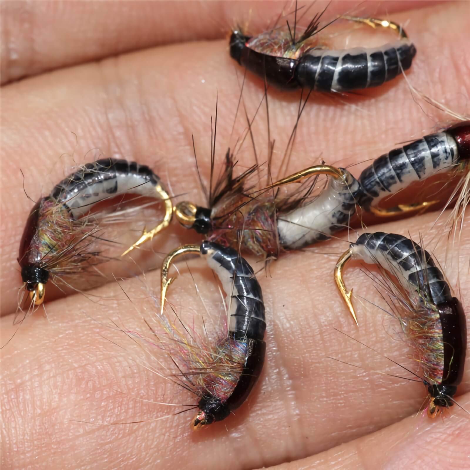Close-up of Jamyor barbed-hook detail on fly lures.