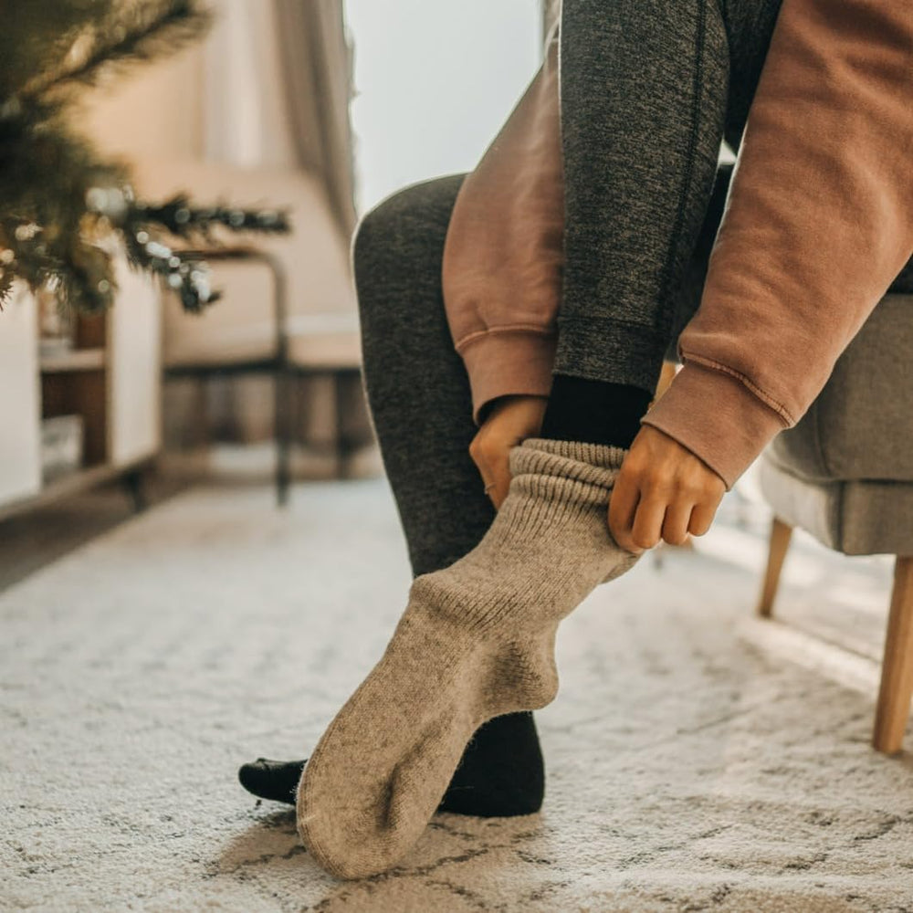 J.B. Field's Arctic Trail socks on snow scene highlight warmth and versatility.
