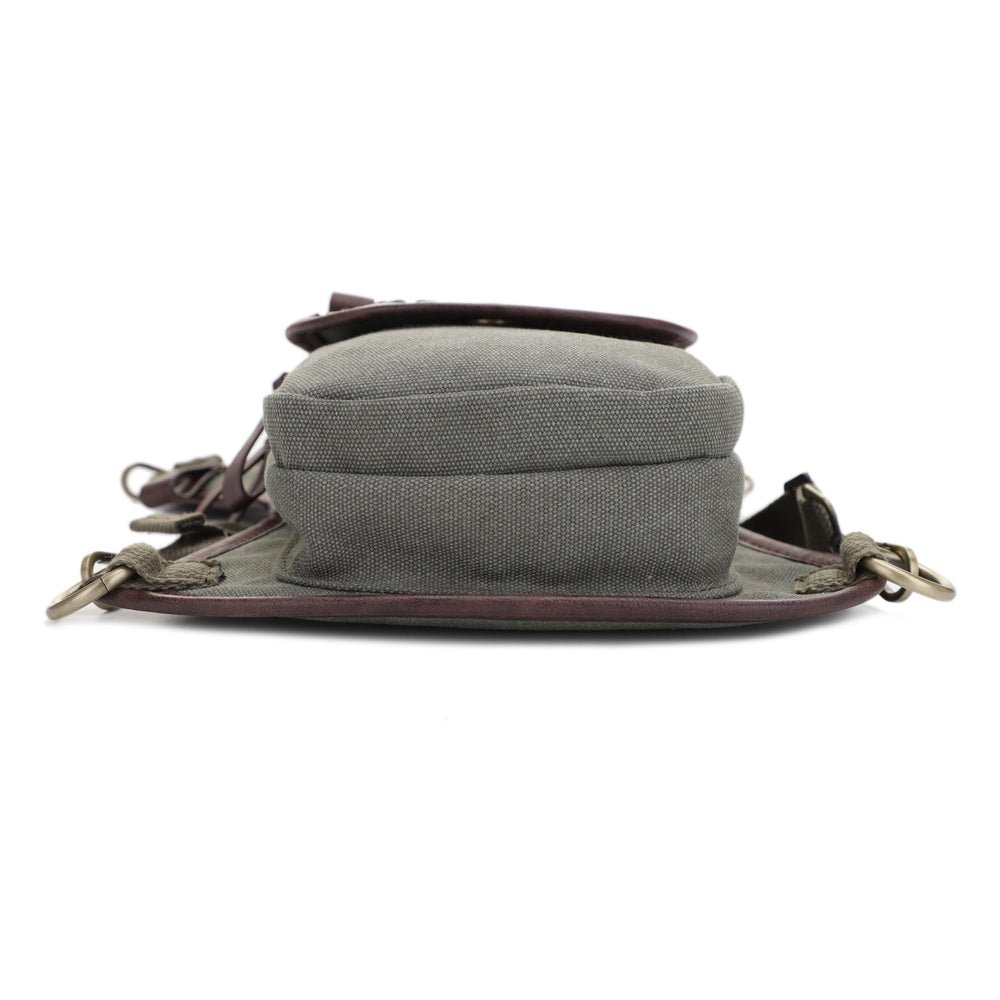 Olive canvas with reinforced stitching emphasizes durability.