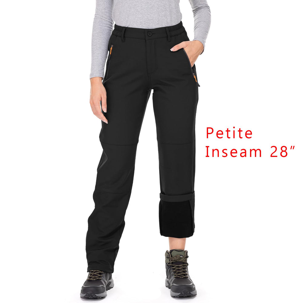 Jessie Kidden waterproof pants pocket detail highlights secure storage for essentials.