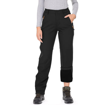 Jessie Kidden women's waterproof pants with side pockets for secure storage.