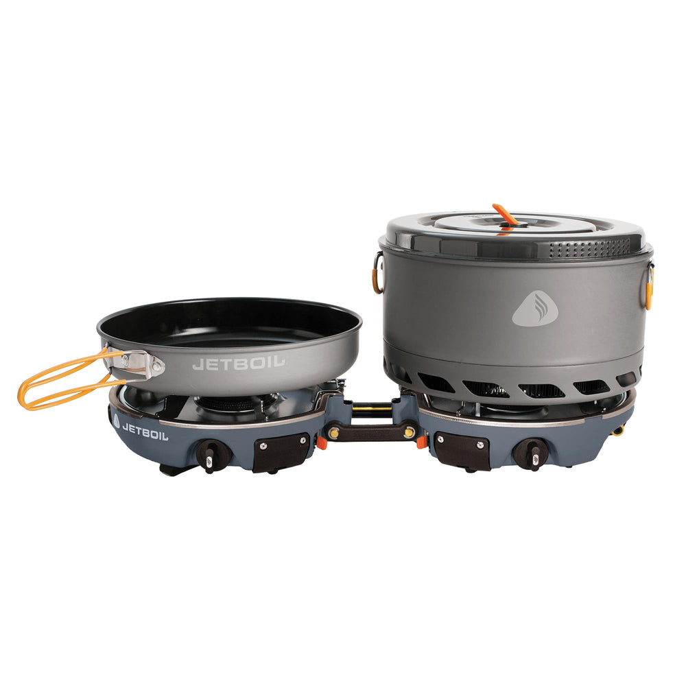 Jetboil Genesis dual-burner stove set up for fast backcountry meals.