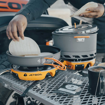 Jetboil Genesis FluxPot 5-liter pot with strainer lid for versatile meals.