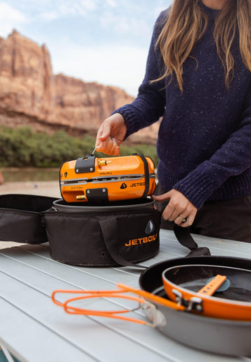 Jetboil Genesis regulator and propane compatibility for standard bottles.