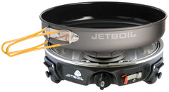 Jetboil HalfGen Basecamp stove setup on a rugged campsite for quick outdoor meals.