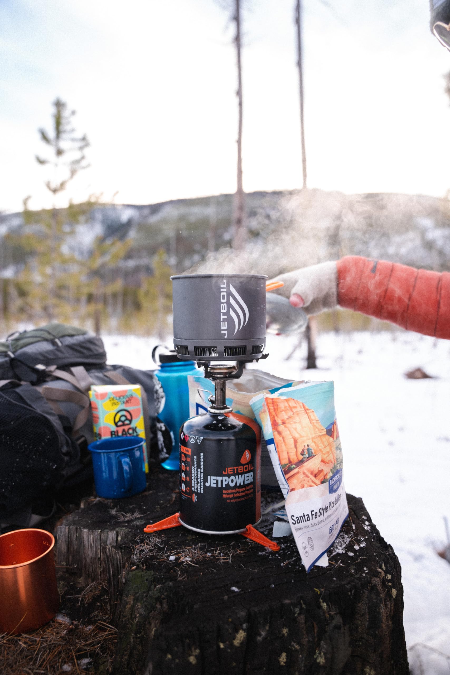 Jetboil JetPower fuel canister on stove, ready for quick boils during trips.