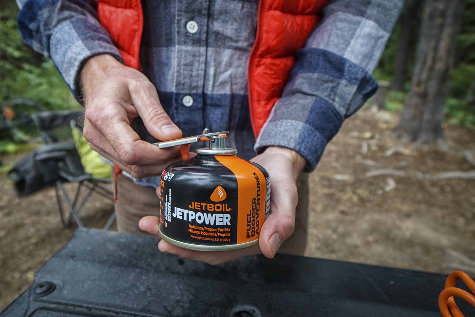 Jetboil JetPower fuel boils water quickly on a camping stove scenario.