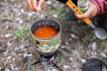 Jetboil MiniMo cooking cup close-up emphasizing efficient FluxRing heat transfer.