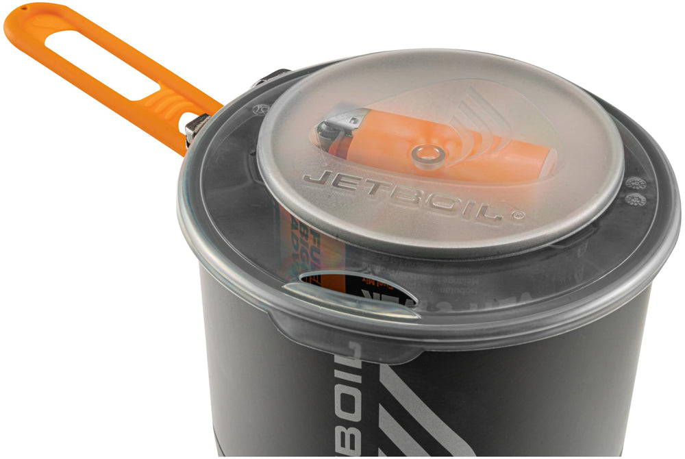 Jetboil Stash attached pour handle simplifies safe pouring while cooking.