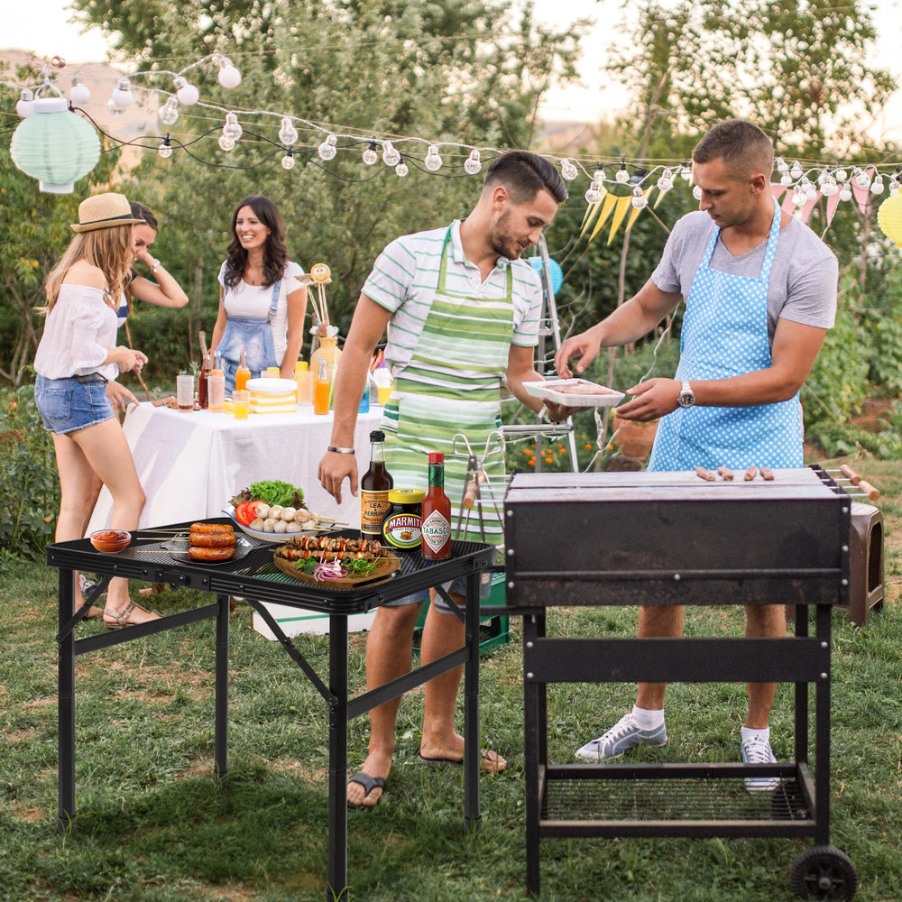 Jkwokback grill table used for multiple outdoor activities