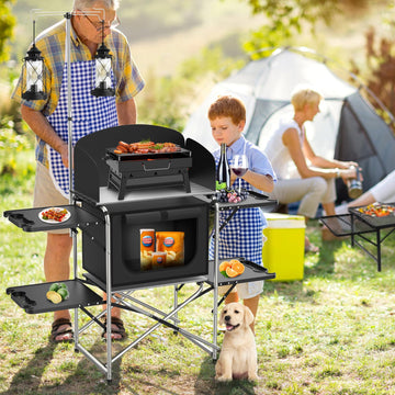 JOUYEK camping table's side tables and hooks keep utensils within reach.