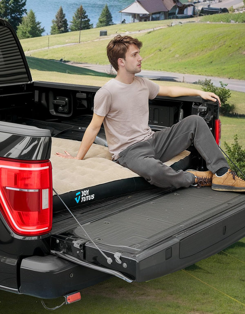 JOYTUTUS truck-bed air mattress cup-holder closeup demonstrates convenient drink access during road trips