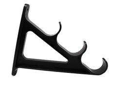 JSP Manufacturing wall rack on the wall holding three rods for easy access.