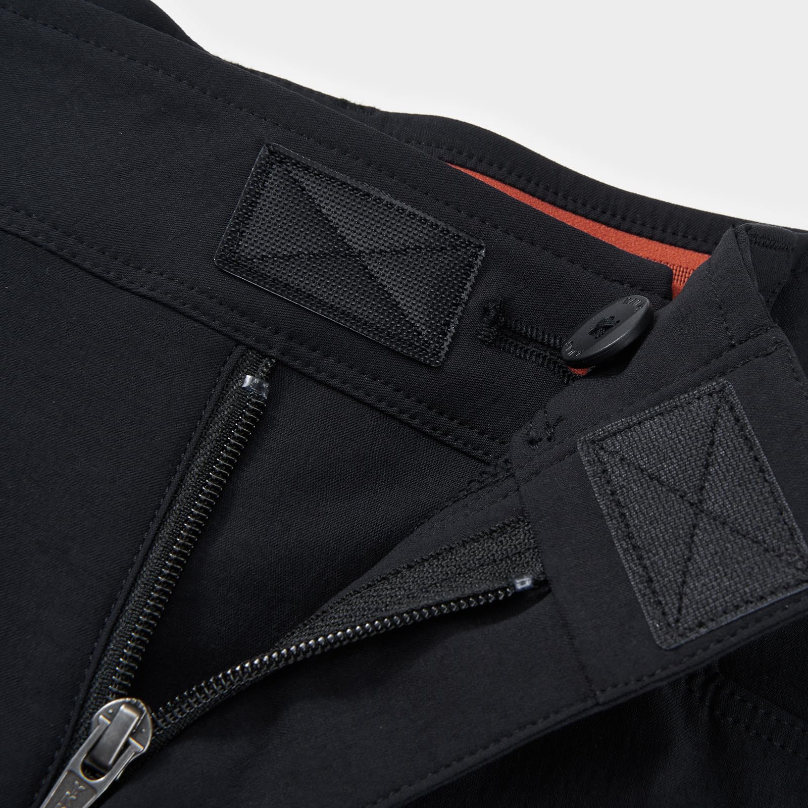 KAILAS men's climbing pants in action during hiking and rock climbing.