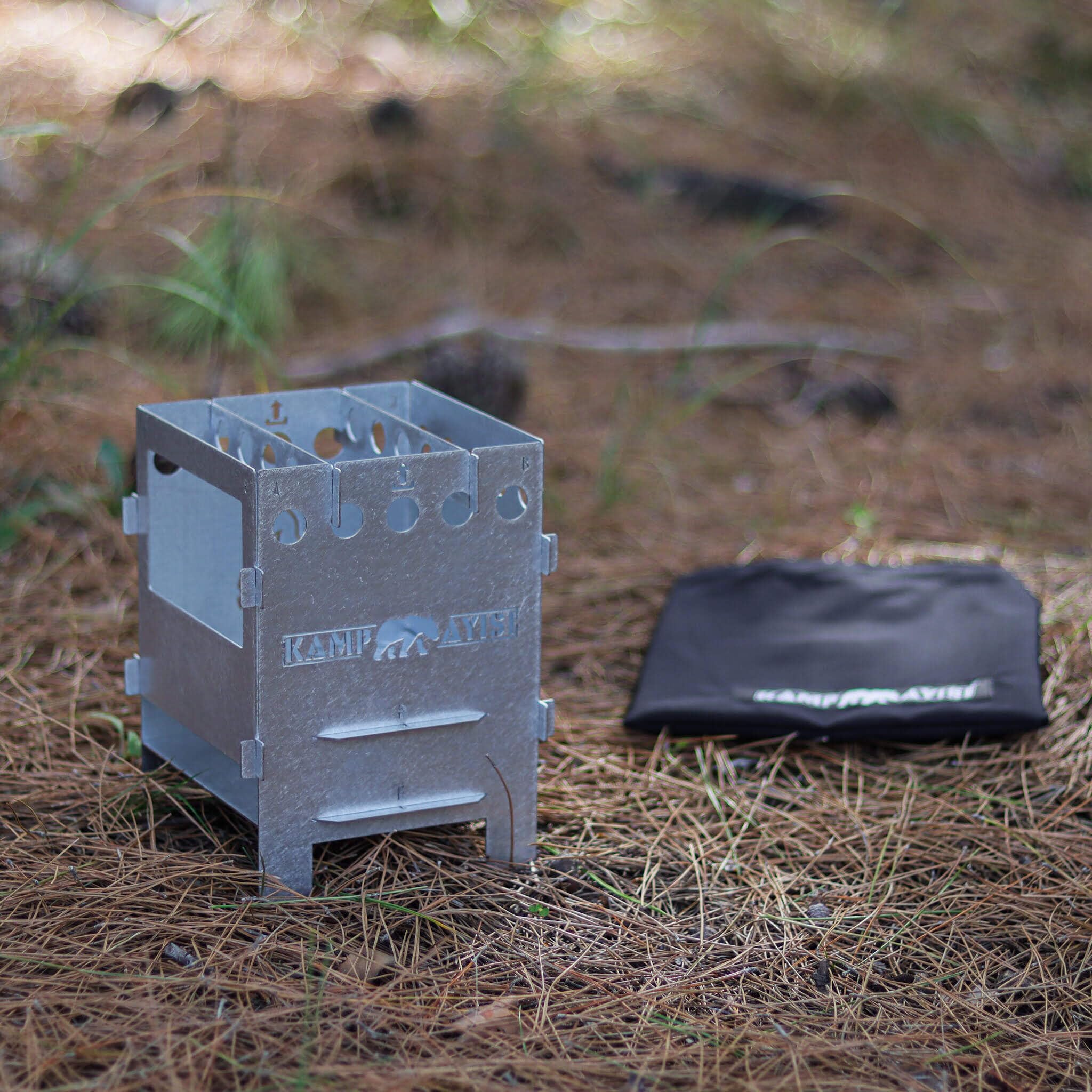 Kamp Ayisi stove used as heater and cooktop during a chilly outdoor evening.