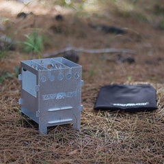 Kamp Ayisi stove used as heater and cooktop during a chilly outdoor evening.