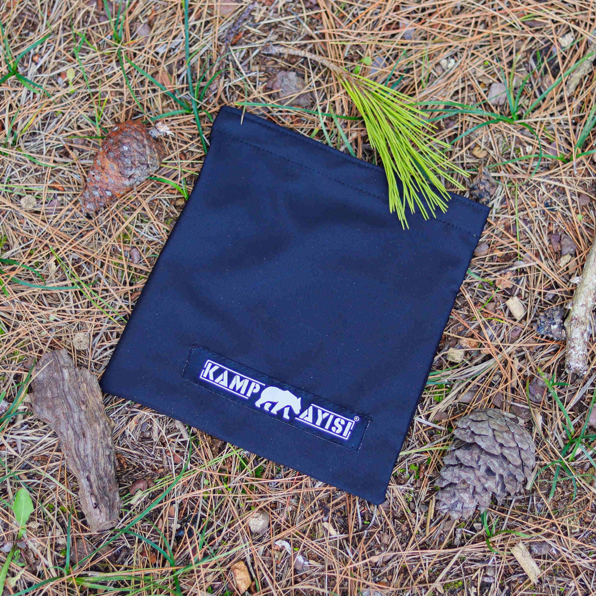 Kamp Ayisi wood-fire compatible stove for traditional campfire cooking experiences.