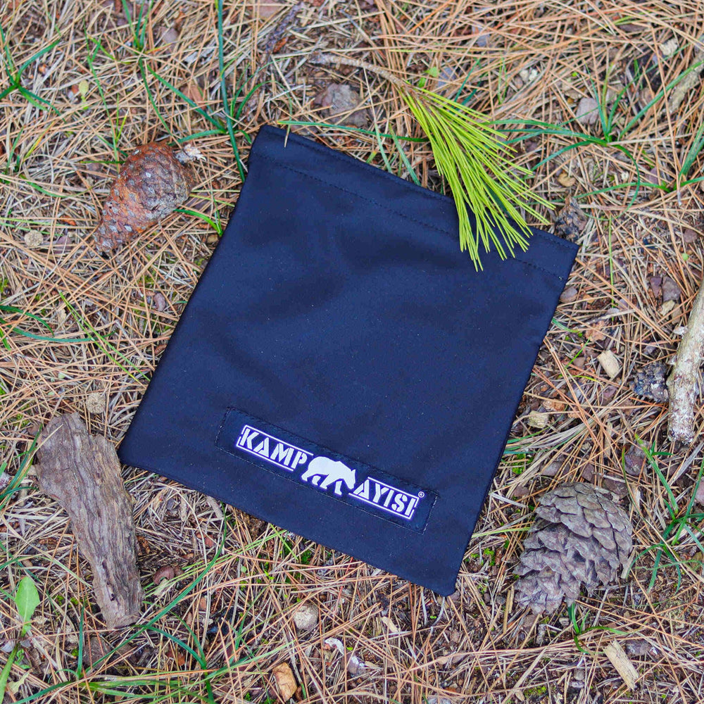 Kamp Ayisi wood-fire compatible stove for traditional campfire cooking experiences.