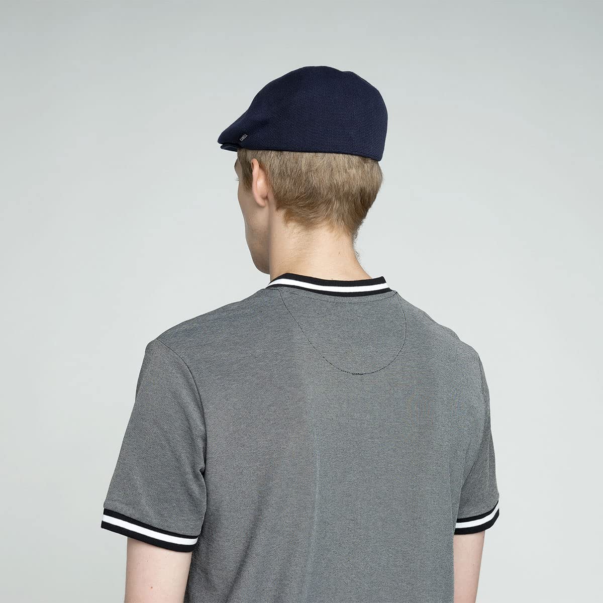 Kangol Bamboo 507 worn with casual outfits for versatile summer styling.