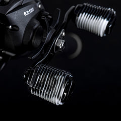 Close-up of silicone G sleeve being installed over a baitcaster handle