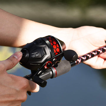 KastKing Brutus Spincast reel in-use left-handed retrieval demonstrating versatility.