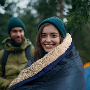 KawaGebo Kamp blanket folded in pack shows portable warmth for hiking and camping.