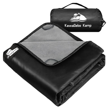 KawaGebo Kamp fleece blanket on campsite keeps you dry on damp ground.