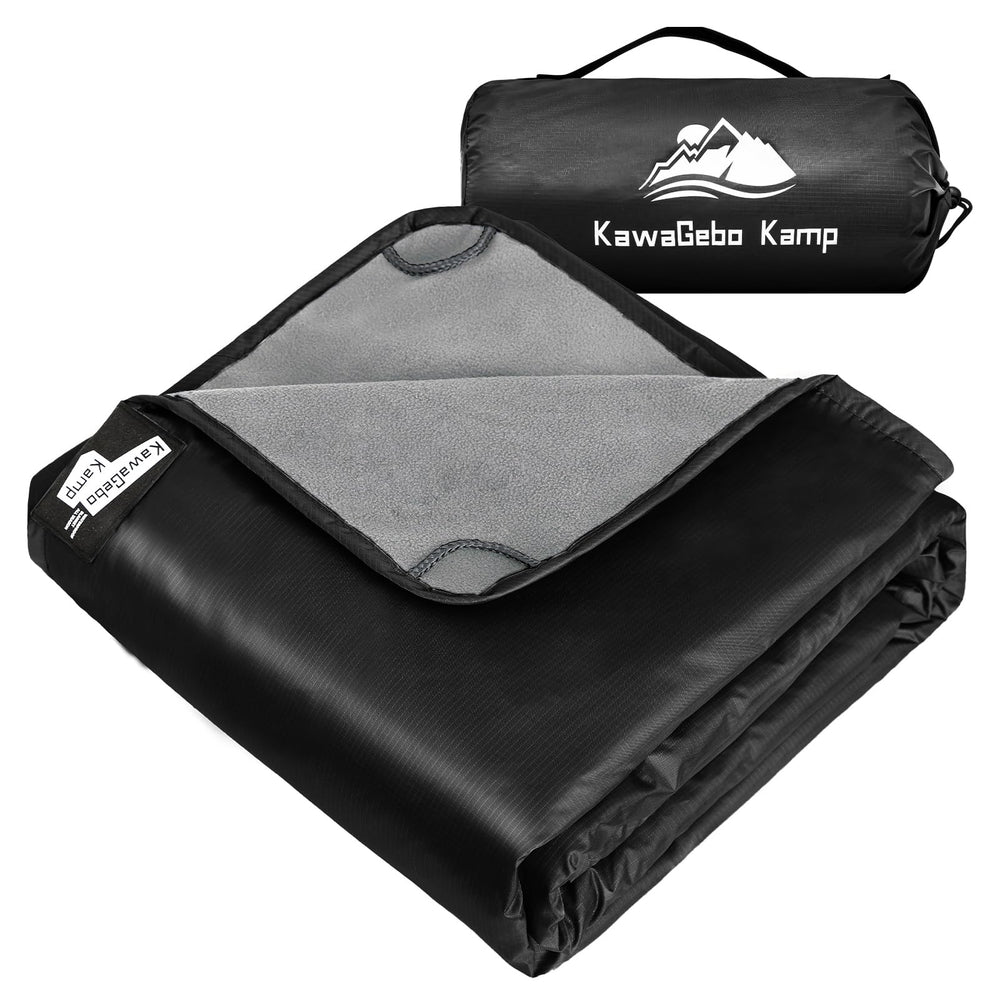 KawaGebo Kamp fleece blanket on campsite keeps you dry on damp ground.