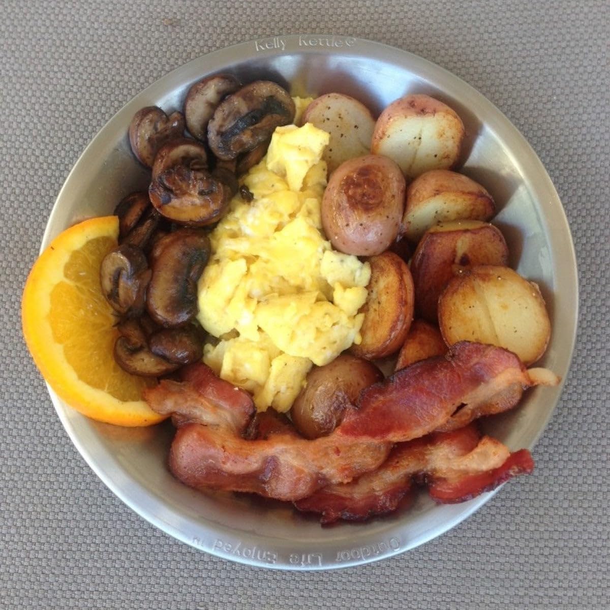 Kelly Kettle Camping Plates functioning as a compact camp fry pan for quick meals.