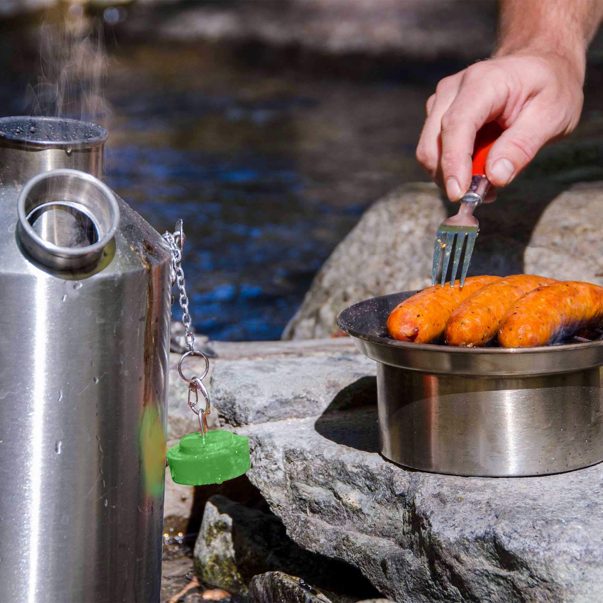 Kelly Kettle pot-support over chimney enables efficient cooking and boiling