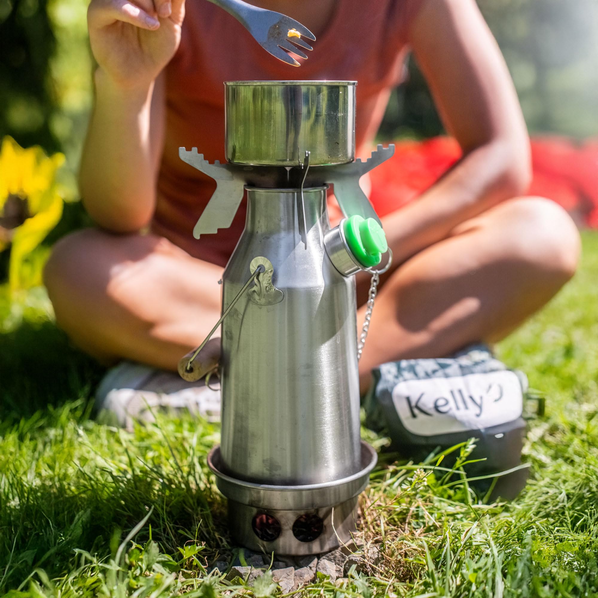 Kelly Kettle Trekker Cook Set on coals demonstrates eco-friendly cooking.