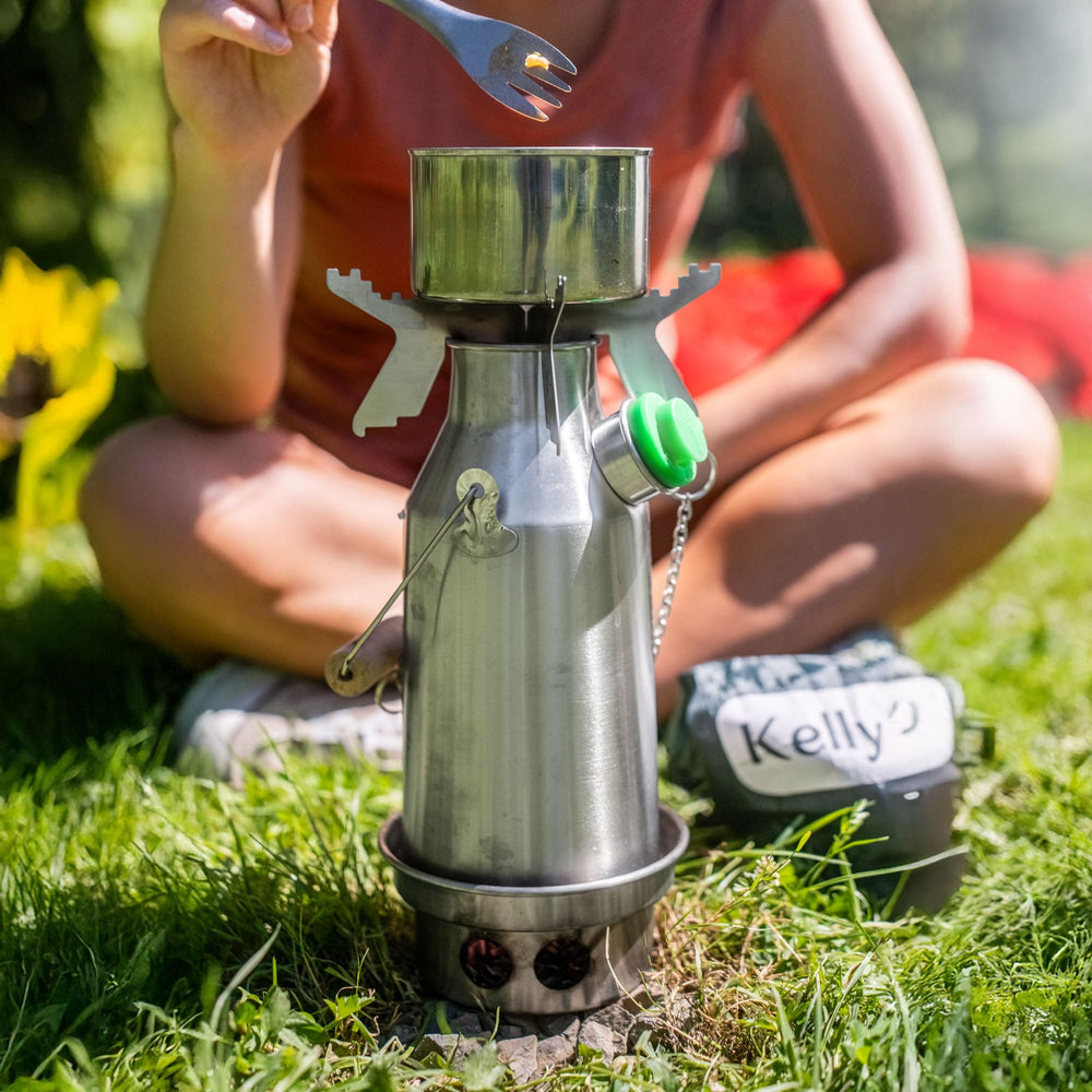 Kelly Kettle Trekker Cook Set on coals demonstrates eco-friendly cooking.