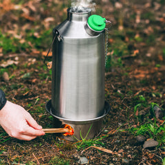 Kelly Kettle using wood-fire base for fuel-free heating outdoors
