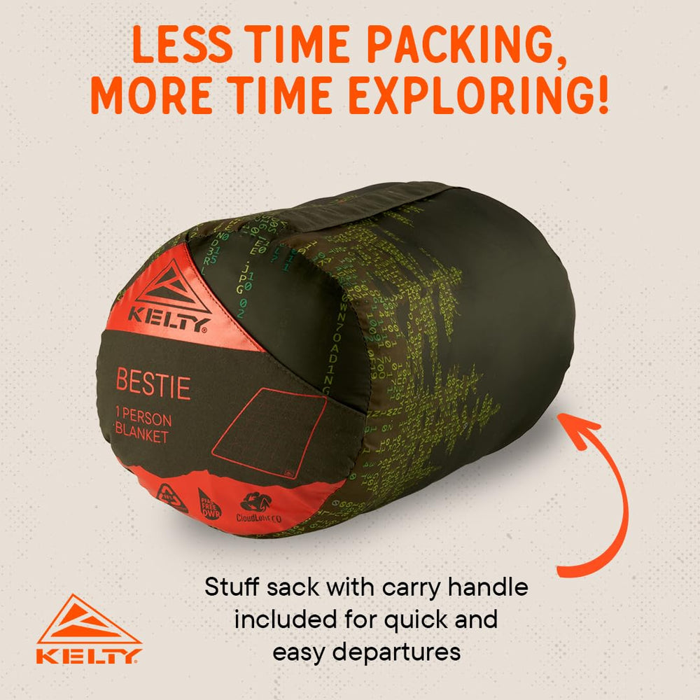 Kelty Bestie Blanket Winter Moss Treeline campsite scene demonstrates outdoor warmth.