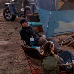 Kelty Deluxe Lounge Chair recline positions demonstrate customizable comfort by the campfire.