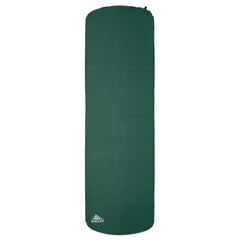 Kelty Mistral self-inflating mummy pad during setup for quick camping comfort.
