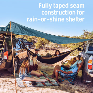 Kelty Noah’s Tarp shading a dining area for outdoor meals.