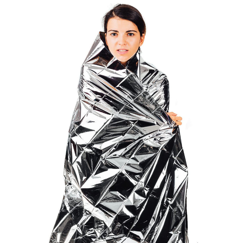 Kemp USA Mylar blanket's reflective surface helps retain body heat in cold wind.