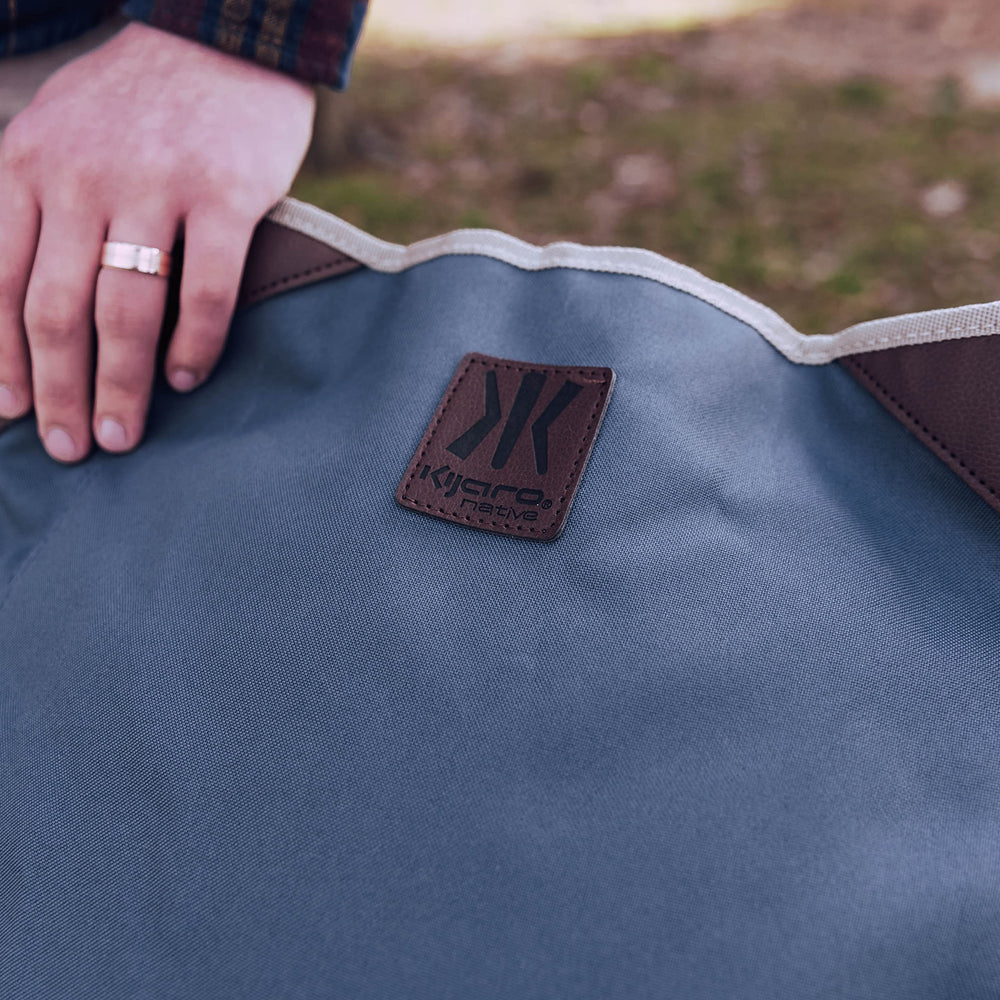 Kijaro Native Comfort Chair in campsite setting for versatile outdoor use.