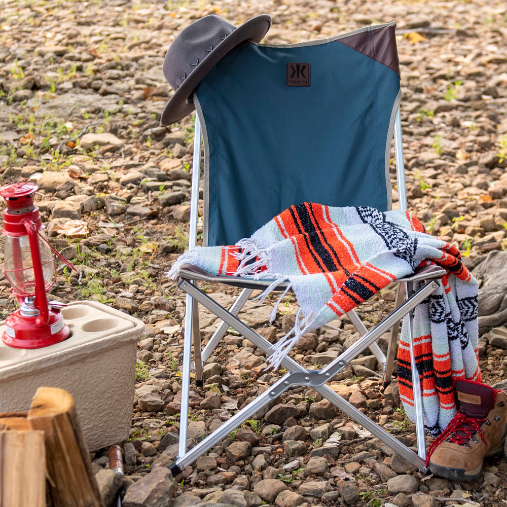 Kijaro Native Comfort Chair folded and tucked into its carry bag for travel.