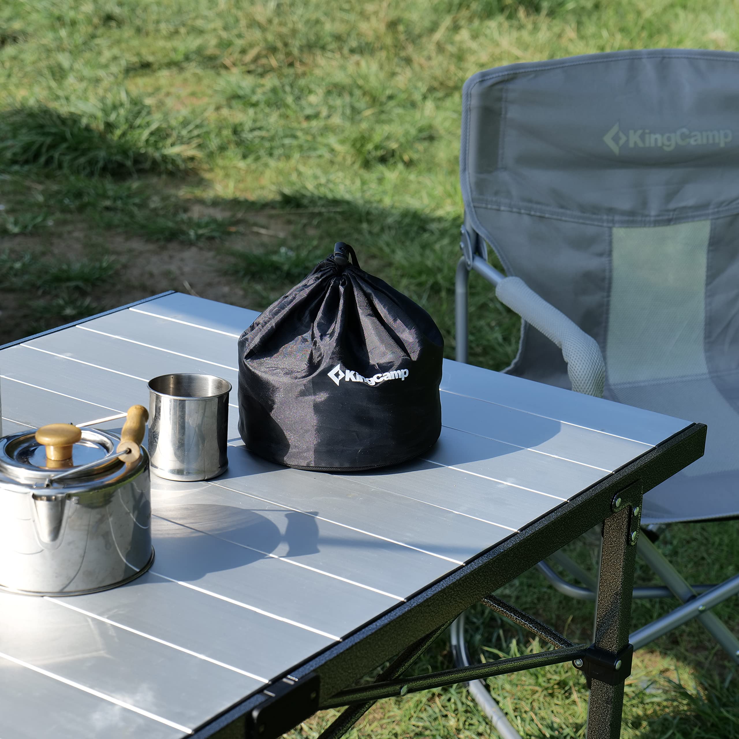 KingCamp camping table rolled up showing quick outdoor setup.