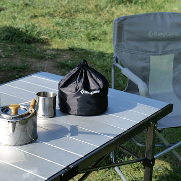 KingCamp camping table rolled up showing quick outdoor setup.
