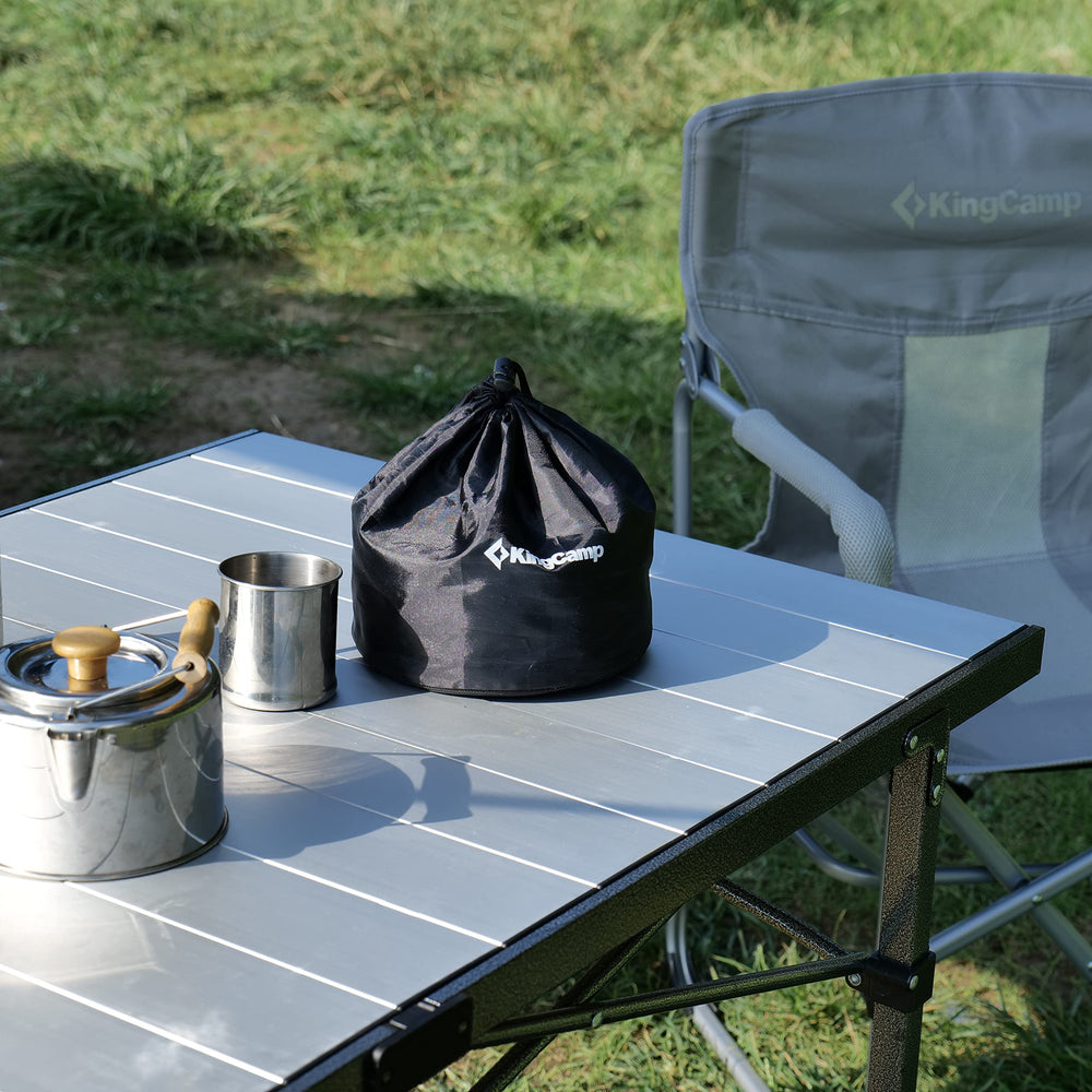 KingCamp camping table rolled up showing quick outdoor setup.