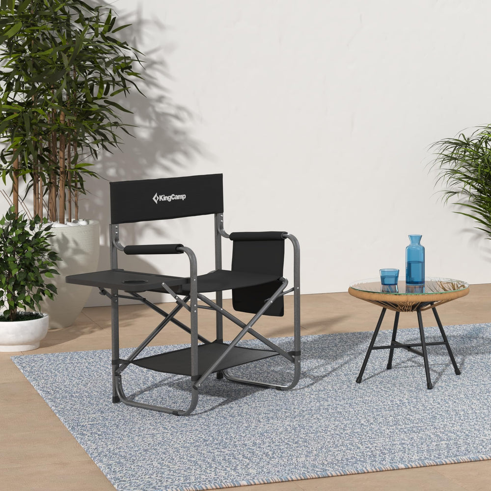 KingCamp Directors Chair storing sunglasses, magazines, and small gear in detachable pockets.