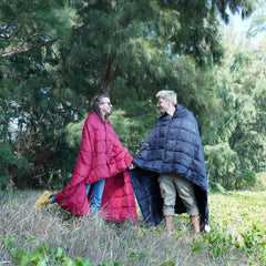 KingCamp blanket worn as a shawl keeps hands free during outdoor activities